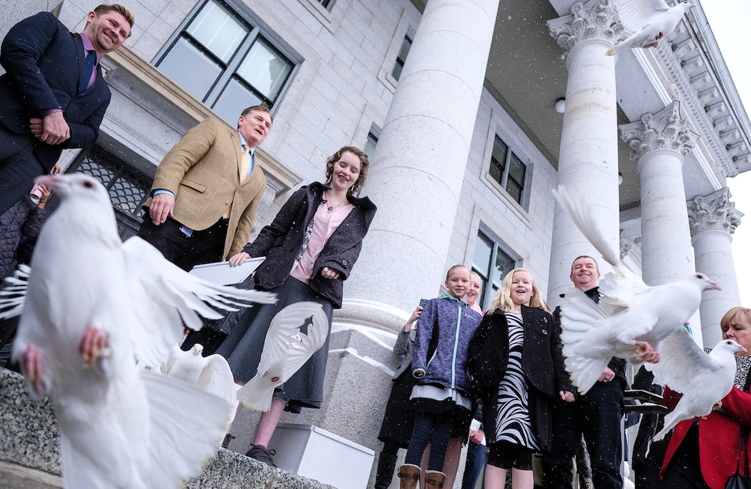 (Francisco Kjolseth  |  The Salt Lake Tribune)  Rep. Val Potter, R-Logan, is joined by Deserae Turner as they release 25 doves on the front steps of the Utah Capitol on Tuesday, Feb. 20, 2018, representing the number of attempts for every suicide death. Turner, a Utah teenage girl who survived being shot in the head by two boys was there to bring attention to bullying and its connection to suicide. 