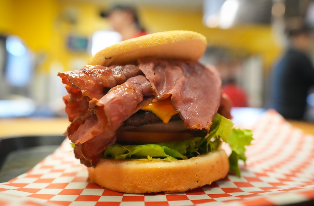 (Bethany Baker | The Salt Lake Tribune) An Apollo Burger, loaded with pastrami, sits on a tray at Apollo Burger in Salt Lake City on Friday, Feb. 21, 2025. All three major Greek-owned burger chains in Utah — Apollo Burger, Crown Burgers and Astro Burgers — all have some version of the pastrami burger.