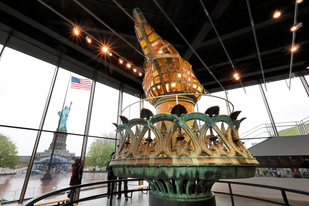 (Richard Drew | AP file photo)  The original torch and flame are displayed in the new Statue of Liberty Museum, on Liberty Island, in New York, Monday, May 13, 2019.