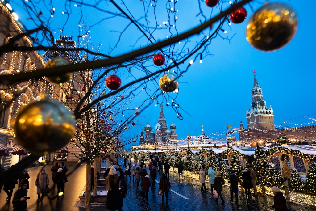(Pavel Golovkin | The Associated Press) People walk in Red Square decorated for Christmas and New Year celebrations, with the St. Basil's Cathedral, center, and the Kremlin's Spasskaya Tower, right, in the background, in Moscow, Russia, Friday, Dec. 21, 2018.