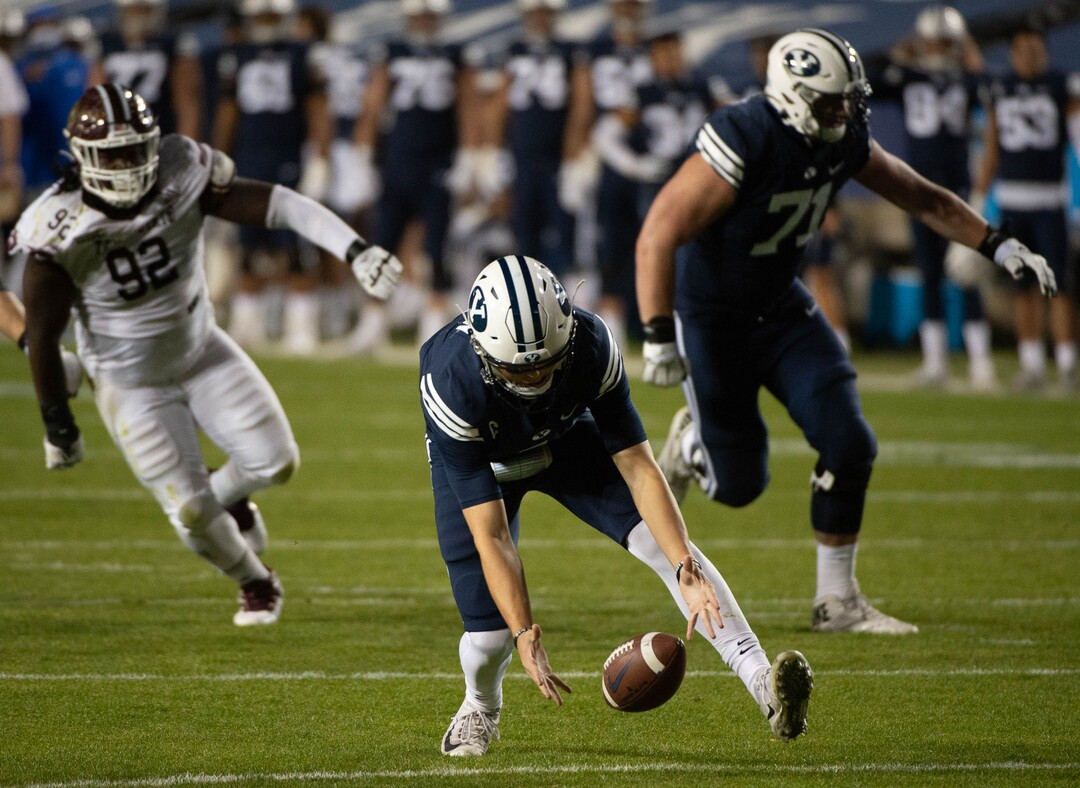 (Francisco Kjolseth  |  The Salt Lake Tribune) Brigham Young Cougars quarterback Zach Wilson (1) fumbles a snap recovered by Texas State near the end zone before the defensive lineup was able to stop any attempts at a touchdown by Texas State during an NCAA college football game at LavVell Edwards Stadium, Saturday, oct. 24, 2020, in Provo, Utah.