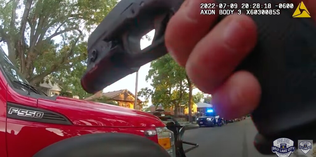 (Salt Lake City Police Department) Body camera footage shows an officer point a firearm at the residence of a man who threatened to shoot first responders on July 9, 2022. Responding officers said the 44-year-old man aimed a shotgun at them before police opened fire. The man suffered survivable injuries.