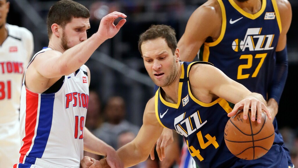Utah Jazz forward Bojan Bogdanovic (44) drives against Detroit Pistons guard Sviatoslav Mykhailiuk (19) during the first half of an NBA basketball game Saturday, March 7, 2020, in Detroit. (AP Photo/Duane Burleson)
