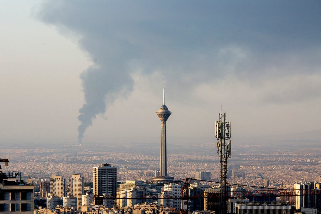 (Arash Khamooshi | The New York Times) Smoke rises from explosions after Israeli strikes in Tehran, Iran, on Sunday, June 15, 2025.