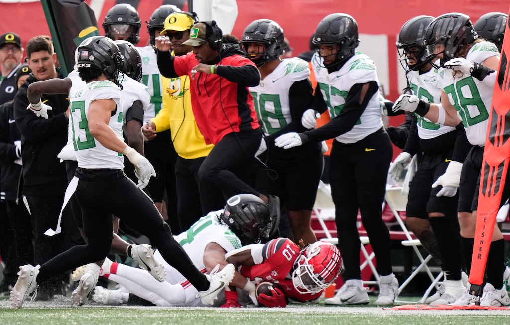 (Francisco Kjolseth  |  The Salt Lake Tribune) Utah Utes receiver Money Parks (10) is tacked in front of the Oregon bench, NCAA football in Salt Lake City on Saturday, Oct. 28, 2023.