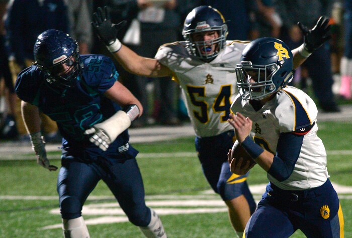 (Leah Hogsten | The Salt Lake Tribune) Summit Academy's Hayden Reynolds runs for a touchdown. Summit Academy boys' football team leads Juan Diego High School 51-35 during their game, October 13, 2017 in Draper.