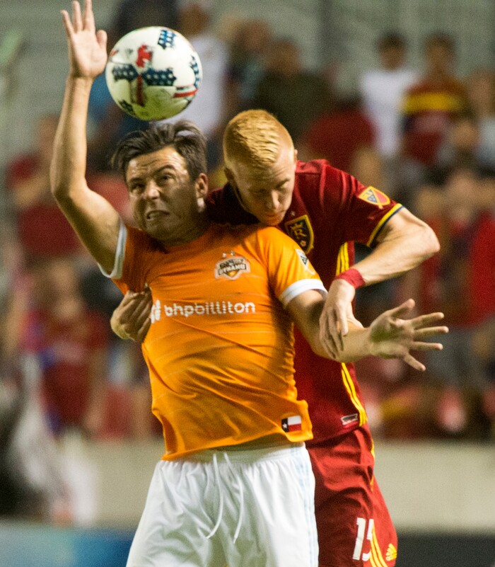 (Rick Egan | The Salt Lake Tribune) Real Salt Lake defender Justen Glad (15) goes for the ball along with Houston Dynamo forward Erick Torres (9), in MLS action, Real Salt Lake Vs. Houston Dynamo, in Sandy, Saturday, August 5, 2017.