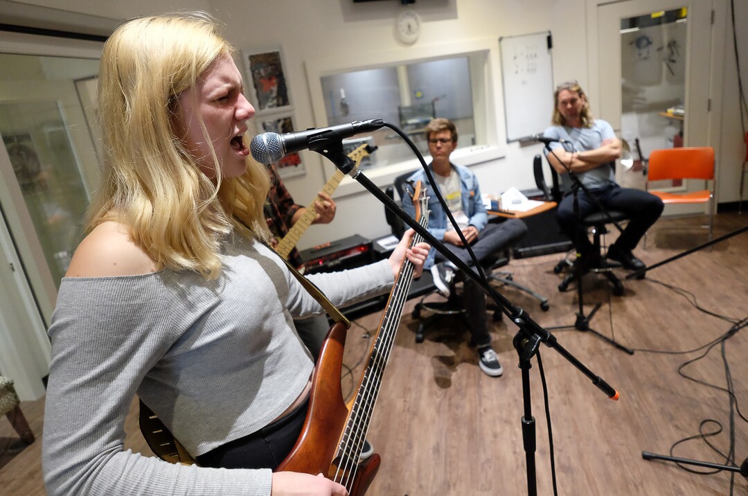 (Francisco Kjolseth  |  The Salt Lake Tribune)  Tallulah Schweitz, 16, belts out the lyrics for Smells Like Teen Sprit while playing the base with other students at MusicGarage.org, in Sugarhouse on Monday, May 20, 2019. Kids learn to rock and roll in hopes of joining a kids band to perform at festivals this Summer.