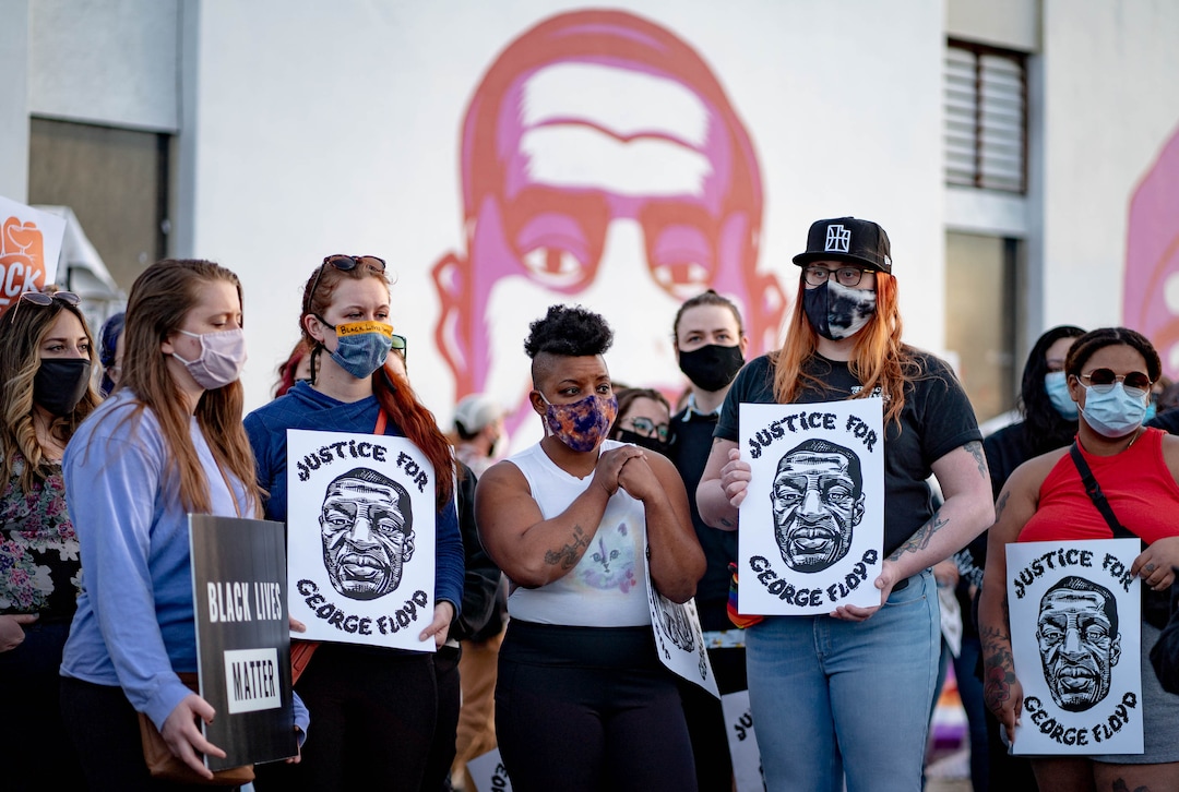 (Francisco Kjolseth  | The Salt Lake Tribune) People gather at the murals of people killed by police in Salt Lake City on Tuesday, April 20, 2021, following the guilty verdict on all three counts in the murder trial of former Minneapolis police Officer Derek Chauvin in the death of George Floyd.