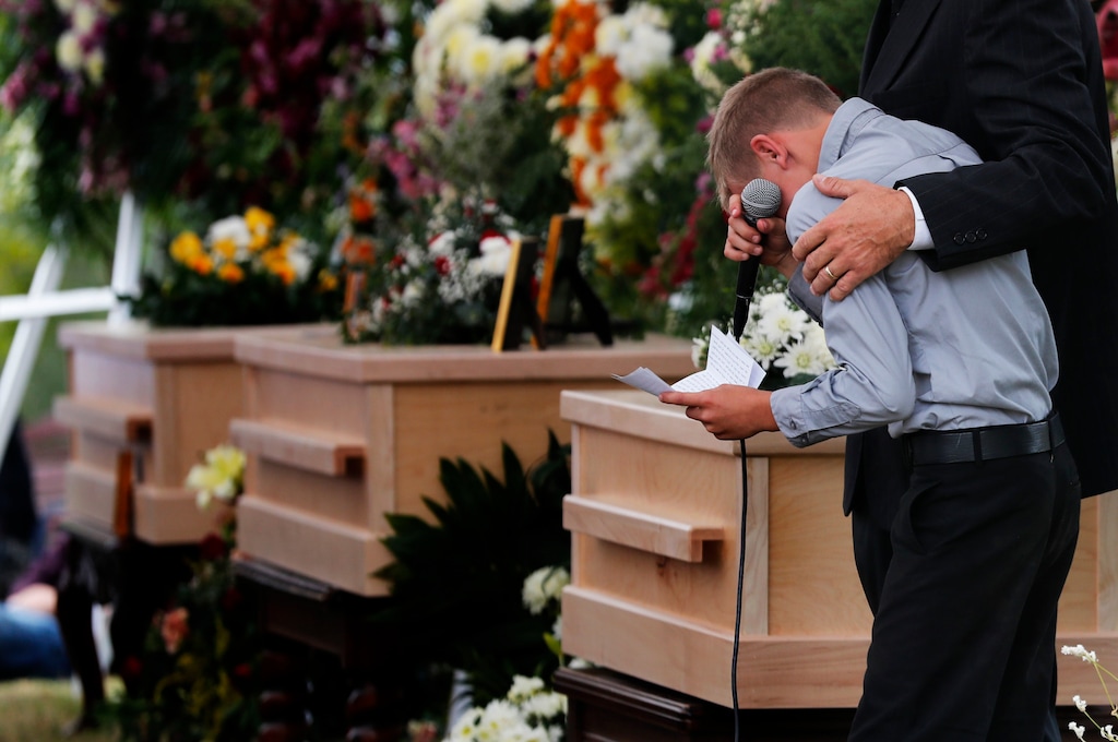 (AP Photo/Marco Ugarte)

A boy pauses as he speaks next to the coffins of Dawna Ray Langford, 43, and her sons Trevor, 11, and Rogan, 2, who were killed by drug cartel gunmen, during the funeral at a family cemetery in La Mora, Sonora state, Mexico, Thursday, Nov. 7, 2019. Three women and six of their children, all members of the extended LeBaron family, died when they were gunned down in an attack while traveling along Mexico's Chihuahua and Sonora state border.