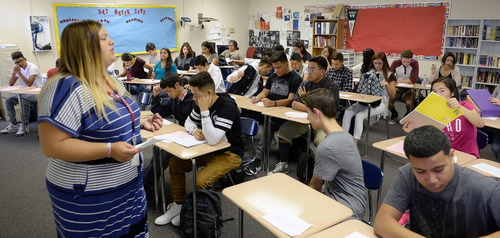Al Hartmann  |  The Salt Lake Tribune
Teacher Brook Taylor gives her new students their first writing assignment for ACT Prep class at Granger High School. There is not an empty seat in her modular classroom. She has over 40 students.