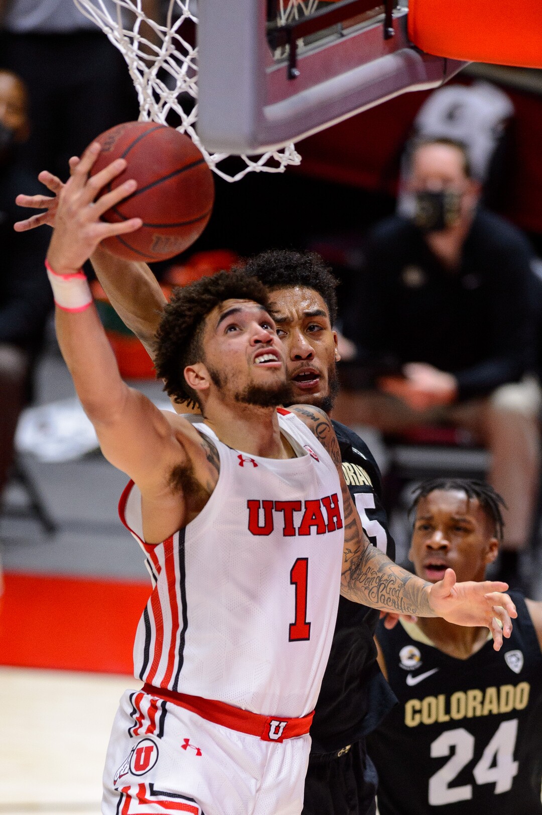 (Trent Nelson  |  The Salt Lake Tribune) Utah Utes forward Timmy Allen (1) shoots, with Colorado Buffaloes guard D'Shawn Schwartz (5) defending, as Utah hosts Colorado, NCAA basketball in Salt Lake City on Monday, Jan. 11, 2021.
