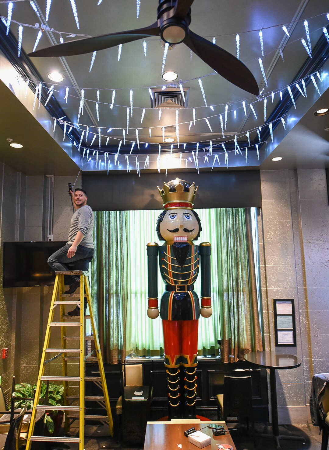 (Francisco Kjolseth  |  The Salt Lake Tribune)  Tommy Girrbach, the food and beverage manager at the Hotel Monaco, transforms the bar into a Christmas–themed pop-up with holiday drinks and decorations, including a 12-foot nutcracker.