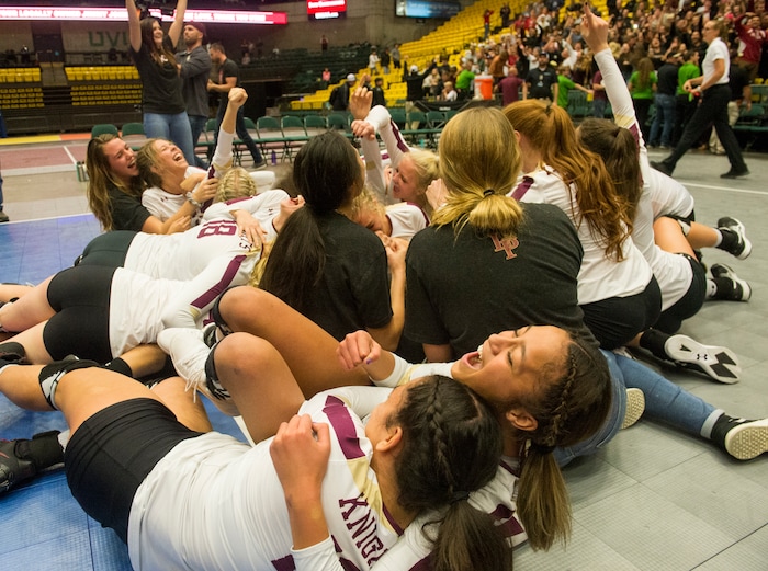(Rick Egan  |  The Salt Lake Tribune)    The Lone Peak Knights celebrate their win over the Pleasant Grove Vikings, for the 6A volleyball championship, at Utah Valley University, Saturday, November 4, 2017.