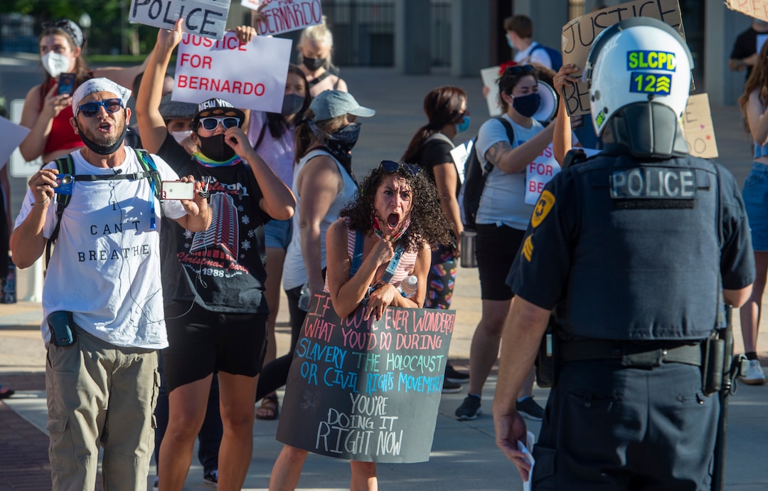 (Rick Egan  |  The Salt Lake Tribune) Protesters face off with the Salt Lake City Police, who threatened to arrest anyone who stepped off of the sidewalk during a Justice for Bernardo Palacios march in Salt Lake City on Tuesday, June 23, 2020.