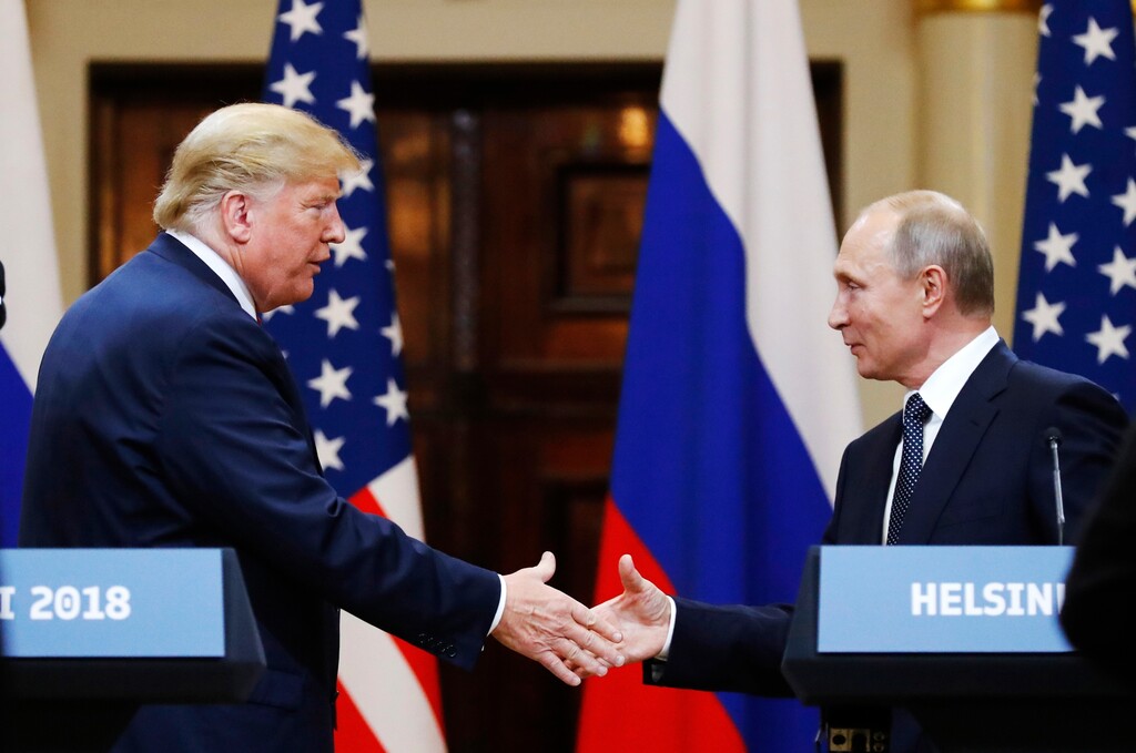 FILE In this file photo taken on Monday, July 16, 2018, U.S. President Donald Trump shakes hand with Russian President Vladimir Putin at the end of the press conference after their meeting at the Presidential Palace in Helsinki, Finland. The pullout of U.S. troops from Syria ordered by President Donald Trump could further bolster Moscow’s clout in Syria, but it may also destabilise Russia's standing in the region. (AP Photo/Alexander Zemlianichenko, File)