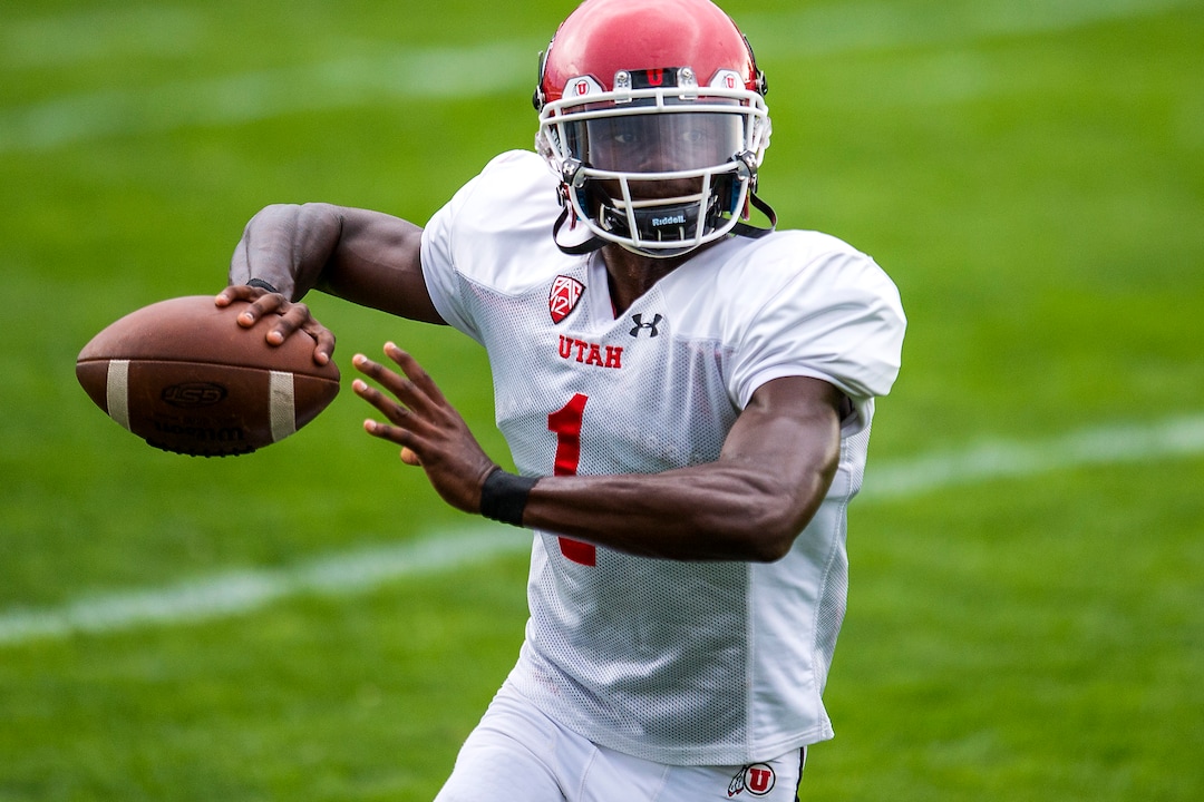(Chris Detrick  |  The Salt Lake Tribune) Utah Utes quarterback Tyler Huntley (1) throws the ball during practice Tuesday, August 22, 2017. 