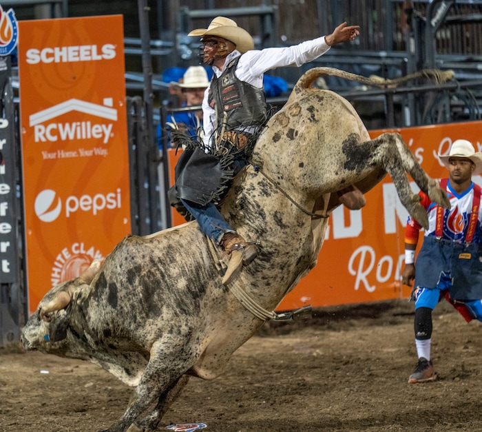 (Rick Egan | The Salt Lake Tribune)  Cole Fischer, from Jefferson City, Mo., competes in bull riding at the Utah Days of '47 Rodeo at the State Fairpark, on Monday, July 25, 2022.