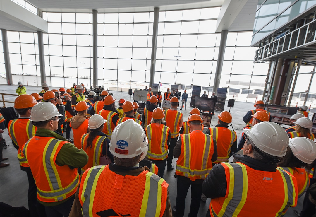 (Francisco Kjolseth  |  The Salt Lake Tribune)  People gather in the large Terminal Plaza of Concourse A, as Salt Lake City International Airport announces food concessionaires for the first phase of the new expanded airport during a tour on Wed. Feb. 20, 2019, that is said to include 23 concepts with a number of home-grown options that are local favorites.