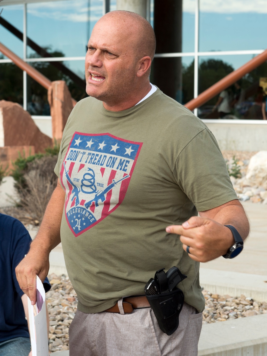 (Rick Egan  |  The Salt Lake Tribune)   Kish North from South Jordan, points out that he is carrying a weapon, as he argues against gun control, before a town hall meeting in Sandy, where survivors from the Florida school shooting held a forum with Utah students involved with the March for Our Lives movement, Saturday, July 14, 2018.
