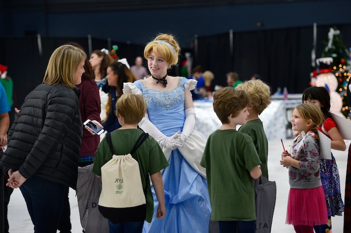(Scott Sommerdorf   |  The Salt Lake Tribune)   Kids line up to speak to the Frozen character "Elsa" as patients from Primary ChildrenÕs and Shriners Hospitals were treated to a unique experience on Saturday at a Delta hangar of the Slat Lake International airport. They boarded a Boeing 737 which taxied to their final destinationÑSantaÕs Winter Wonderland, Saturday, December 2, 2017.  