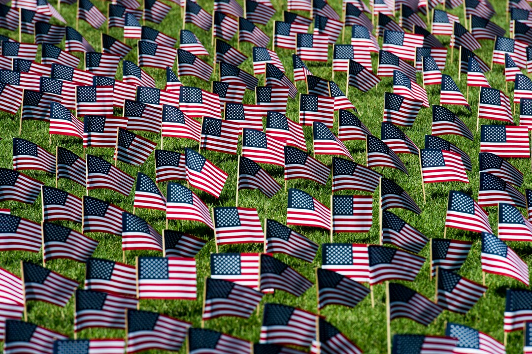 (Rick Egan  |  The Salt Lake Tribune)   3000 flags wave in the grass in front of Skyline High School in memory of those who lost their lives 17 years ago.  Tuesday, Sept. 11, 2018.