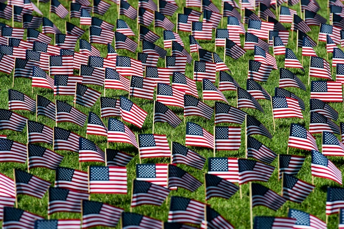 (Rick Egan | The Salt Lake Tribune) 3000 flags wave in the grass in front of Skyline High School in memory of those who lost their lives 17 years ago. Tuesday, Sept. 11, 2018.