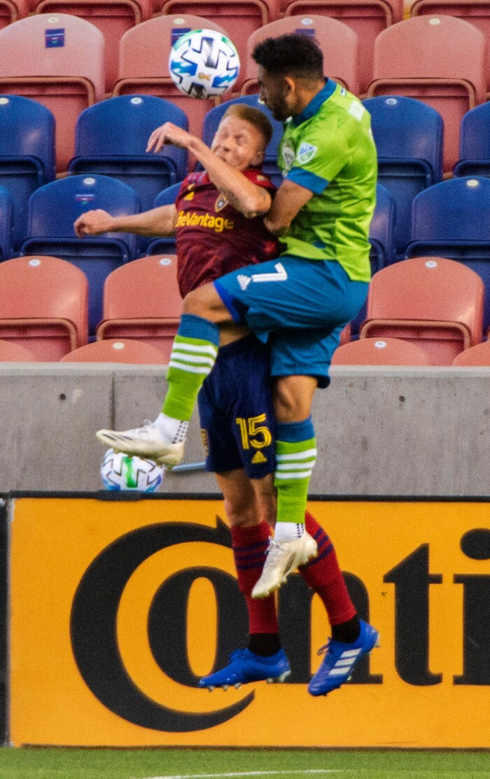 (Rick Egan  |  The Salt Lake Tribune)     Real Salt Lake defender Justen Glad (15) and Seattle Sounders midfielder Cristian Roldan (7) go for the ball, in MLS soccer action between Real Salt Lake and the Seattle Sounders, at Rio Tinto Stadium, Wednesday, Sept. 2, 2020.
