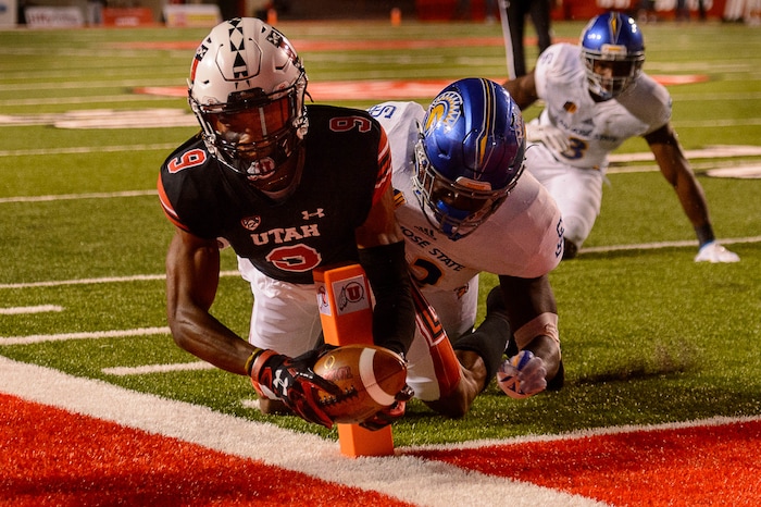 (Trent Nelson | The Salt Lake Tribune) Utah Utes wide receiver Darren Carrington II (9) scores a touchdown, with San Jose State Spartans linebacker Jamal Scott (42) defending, as the Utah Utes host the San Jose State Spartans, NCAA football at Rice-Eccles Stadium in Salt Lake City, Saturday September 16, 2017.