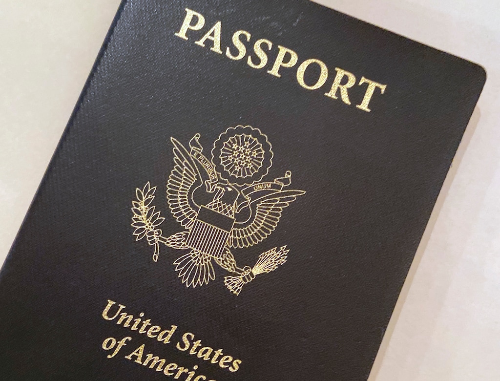 (Eileen Putman | AP) This May 25, 2021, photo shows a U.S. passport cover. Sens. Mitt Romney and Mike Lee have created a combined staff to help Utahns avoid increasingly long delays in getting their passports.
