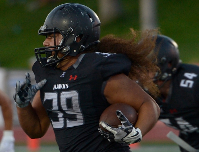 (Leah Hogsten  |  The Salt Lake Tribune) Alta's Tu'u Afu with the carry. Lehi High School leads Alta High School 42-28 during their game, Friday, August 18, 2017 in Sandy. 