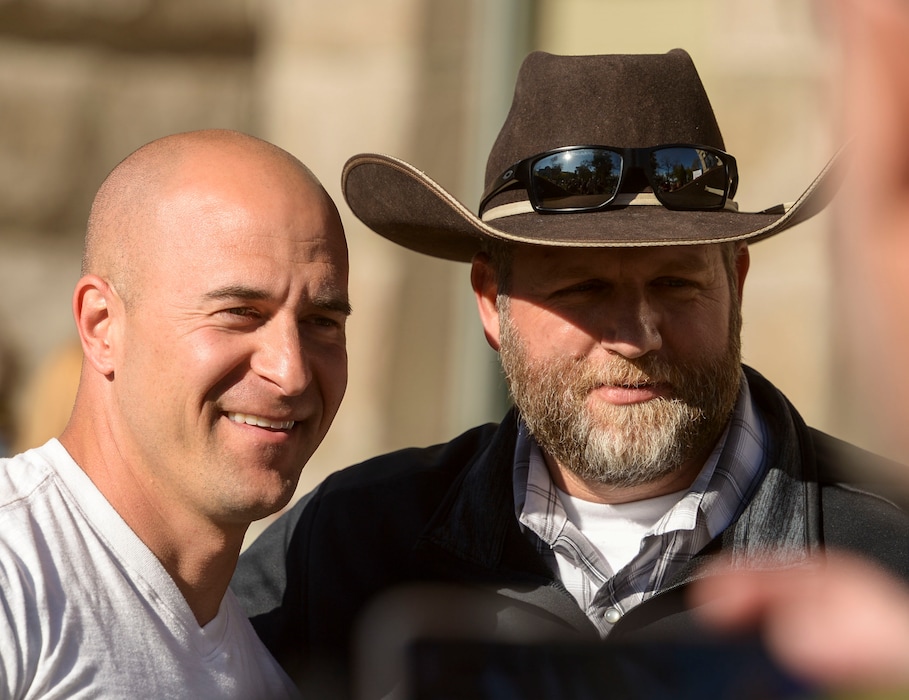 (Leah Hogsten | The Salt Lake Tribune) l-r Eric Moutsos, event organizer and Ammon Bundy pose for a photo. About 1,000 people protested the government mandated shutdown of businesses on the grounds of Salt Lake City Hall, Saturday. The protest was organized by Utah Business Revival aimed at Mayor Erin Mendenhall, Salt Lake County Mayor Jenny Wilsonand Governor Gary Herbert policies on COVID-19 and social distancing, April 18, 2020.