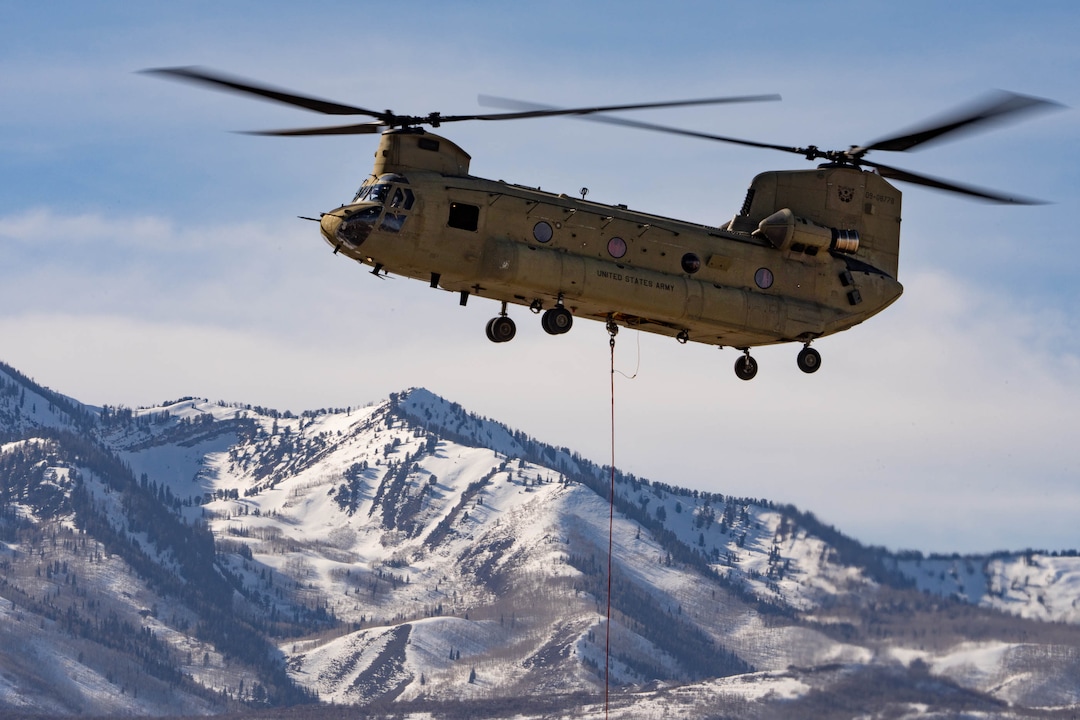 (Francisco Kjolseth | The Salt Lake Tribune) Recovery operations for two Utah Army National Guard UH-60 Black Hawk helicopters involved in a training accident in the Mineral Basin area last week are performed by a CH-47 Chinook helicopter and brought to the Heber Valley Airport on Wednesday, March 2, 2022.