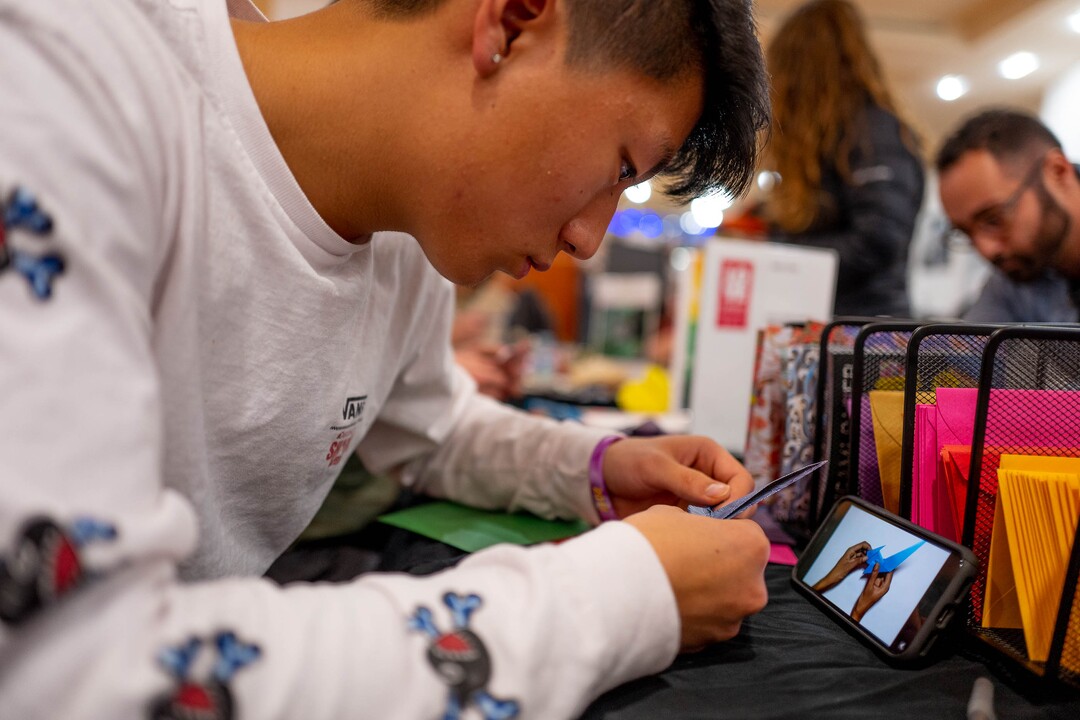 (Trent Nelson  |  The Salt Lake Tribune) Jacob Wee works on origami for the Love Letters project, at the Urban Arts Gallery in Salt Lake City on Friday, Jan. 17, 2020.