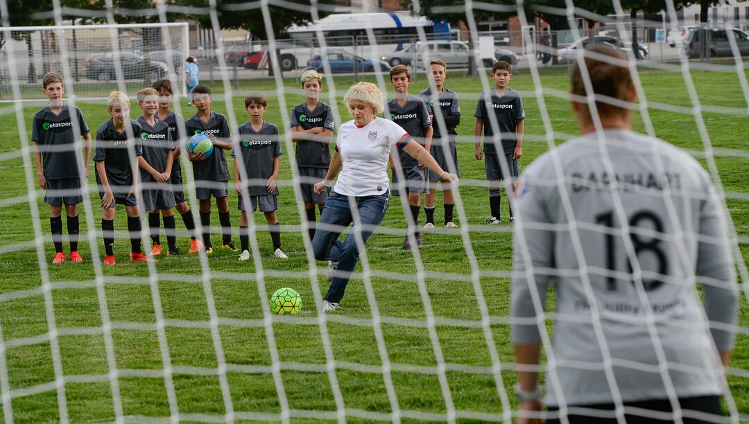 (Francisco Kjolseth  |  The Salt Lake Tribune)  Utah Royals FC goalkeeper Nicole Barnhart goes easy on Mayor Jackie Biskupski during a ceremonial shot on goal as Salt Lake CityÕs Parks and Public Lands Division invites the public to attend a jubilee in celebration of the recently completed improvements at Pioneer Park on Tuesday, September 10, 2019.