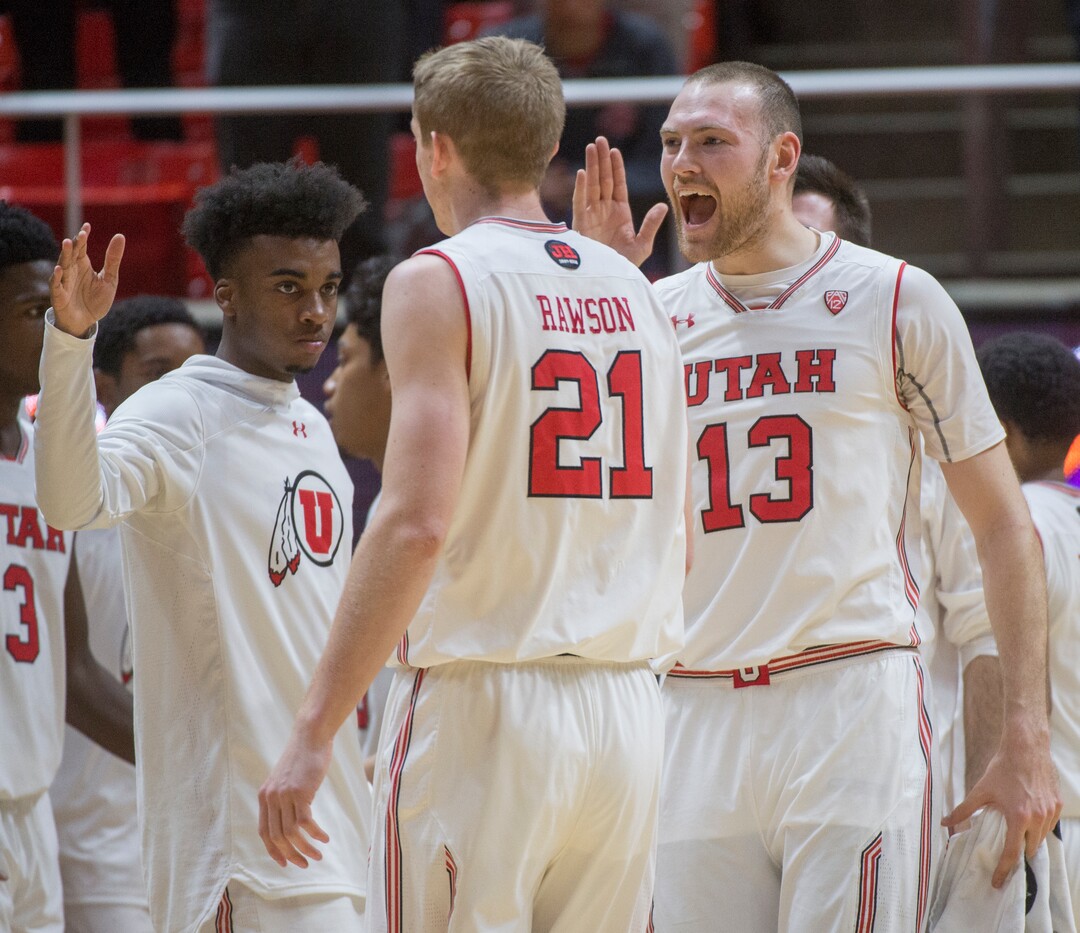 (Rick Egan  |  The Salt Lake Tribune)    Utah Utes guard Kolbe Caldwell (2), Utah Utes forward Tyler Rawson (21) and Utah Utes forward David Collette (13)celebrates as the Utes take a 27-9 lead in the first quarter, in NIT playoff action between Utah Utes and LSU Tigers at the Jon M. Huntsman Center, Monday, March 19, 2018.