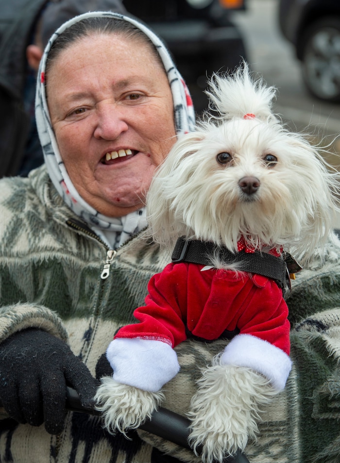 (Rick Egan  |  The Salt Lake Tribune)    Dotty Antonio dressed her dog Carmela for the Street Dawg Crew Christmas outreach at Liberty Park Sunday.  The Street Dawg Crew supports the homeless and their pets every Sunday at Pioneer Park. For today's Christmas Outreach, the Street Dawg Crew passed out food and gift bags for humans and animals, and also offered a photo opportunity with Santa. Sunday, Dec. 22, 2019.