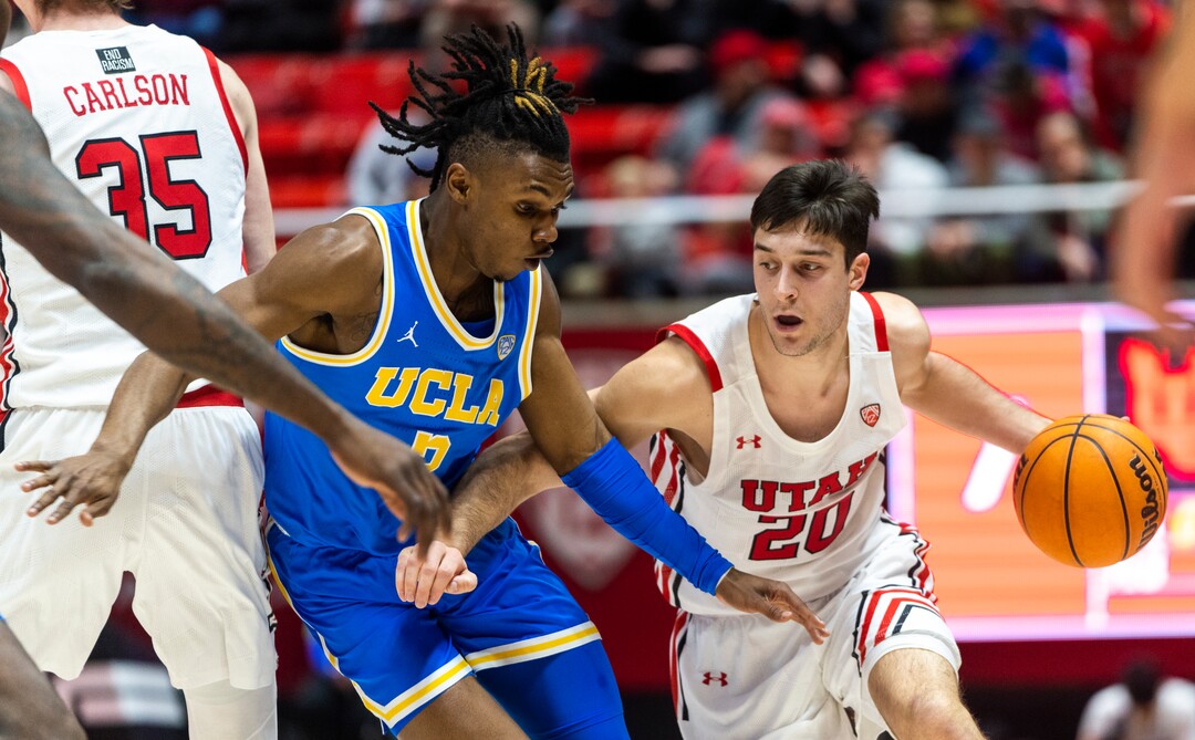 (Rick Egan | The Salt Lake Tribune) Utah Utes guard Lazar Stefanovic (20) is guarded by UCLA Bruins guard Dylan Andrews (2), in PAC-12 basketball action between Utah Utes and UCLA Bruins, at the Jon M. Huntsman Center, Thursday, February. 23, 2022.