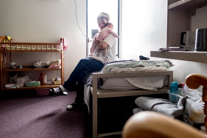 Christine Duckwitz holds her daughter Isabelle inside her room at the Decatur Correctional Center in Decatur, Ill., on April 9, 2018.  (Whitney Curtis | The Washington Post)