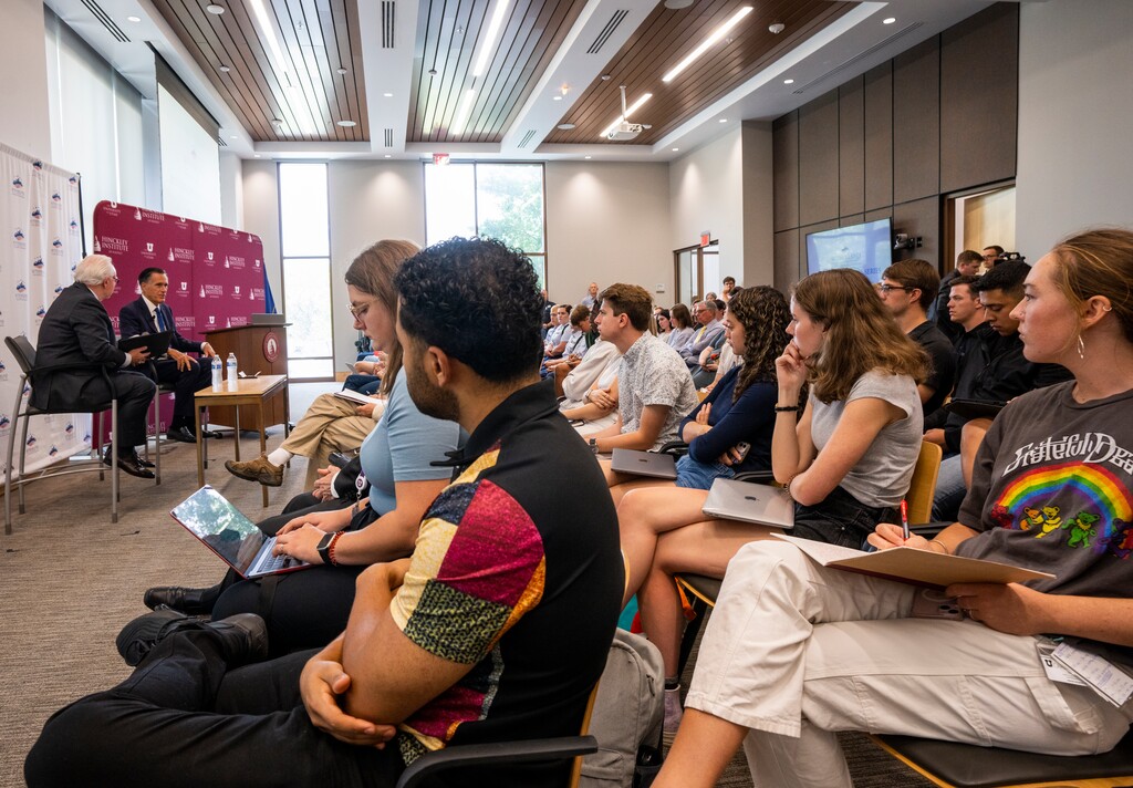 (Rick Egan | The Salt Lake Tribune)  Rick Larsen, from the Sutherland Institute, chats with Sen. Mitt Romney at the Hinckley Institute of Politics on Aug. 21, 2023.