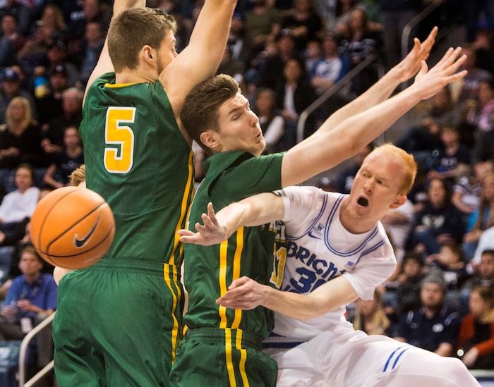 (Rick Egan  |  The Salt Lake Tribune)      Brigham Young Cougars guard TJ Haws (30) tosses a pass around San Francisco defenders, Jimbo Lull (5) and Dons forward Remu Raitanen (11) in basketball action at the Marriott Center, Saturday, February 10, 2018.