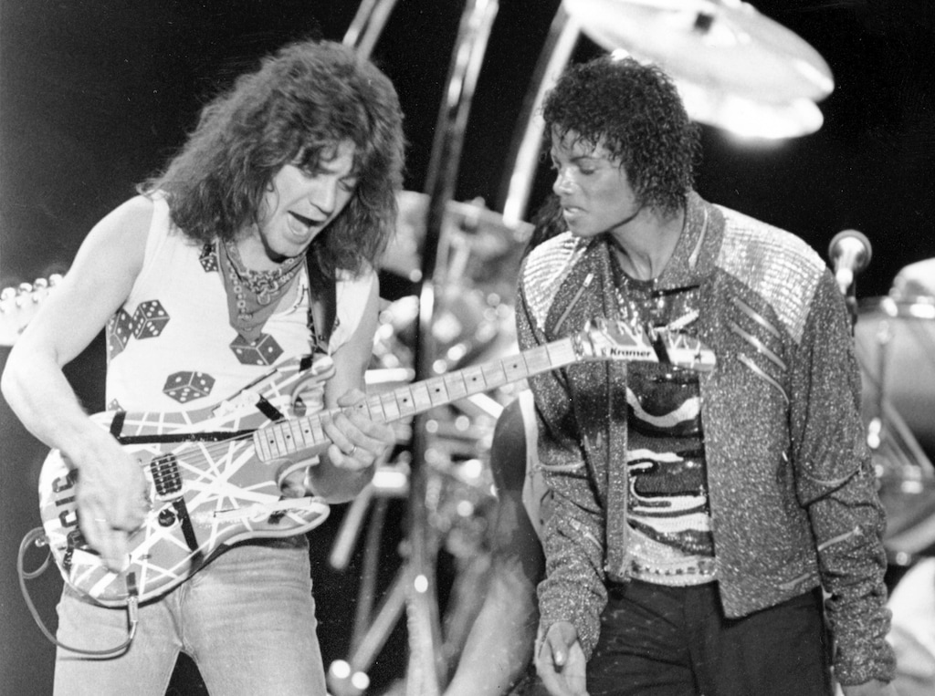 (Carlos Osorio | AP file photo) This July 14, 1984 file photo shows Van Halen guitarist Eddie Van Halen, left, performing "Beat It" with Michael Jackson during Jackson's Victory Tour concert in Irving, Texas. Van Halen, who had battled mouth cancer, died Tuesday, Oct. 6, 2020. He was 65.