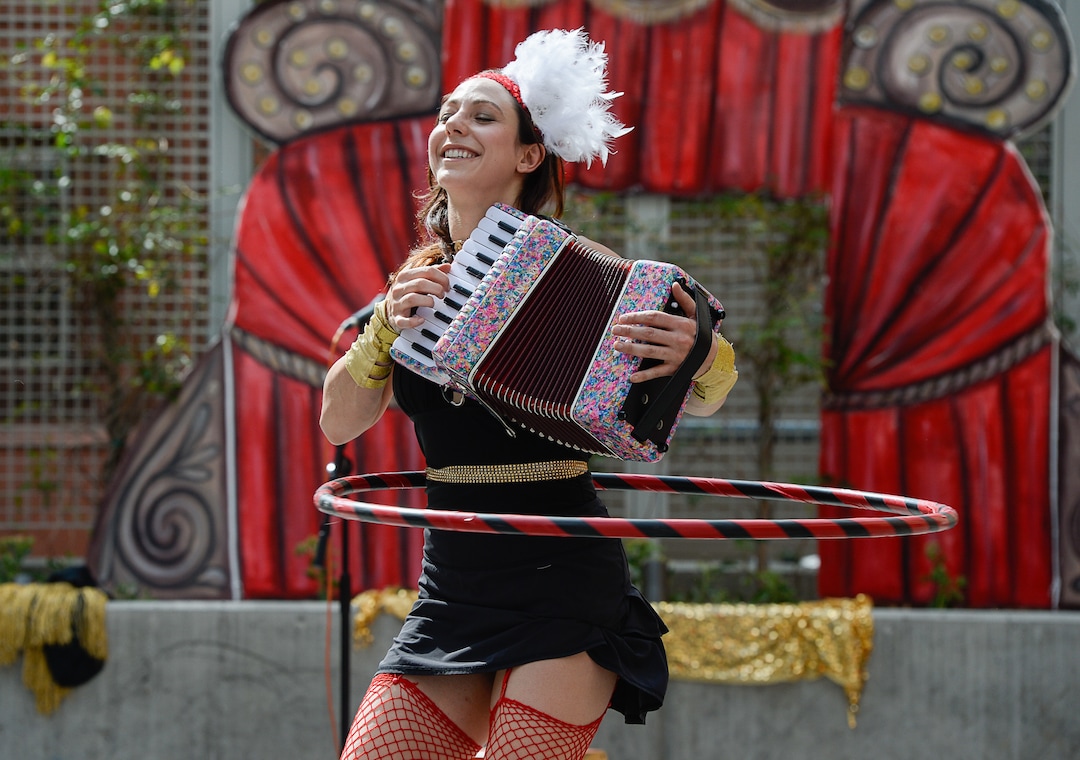 (Francisco Kjolseth  |  The Salt Lake Tribune)  Sarah Tamburelli performs "the year of the dog" as the Salt Lake Arts Council presents the first Busker Fest, featuring entertainers, dancers, musicians, magicians, jugglers, and comedy to celebrate the tradition of street performance and observe the city's vaudeville roots along Regent Street in downtown Salt Lake City on Friday, Aug. 24, 2018.