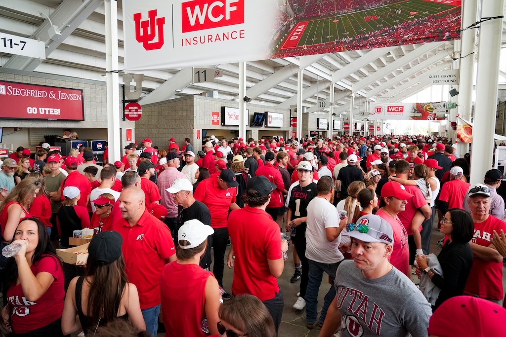 (Bethany Baker | The Salt Lake Tribune) People fill the concourse during the Utah football game in Salt Lake City on Saturday, Sept. 20, 2025.