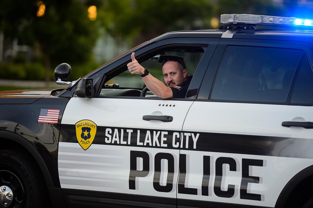 (Trent Nelson  |  The Salt Lake Tribune) A Salt Lake City police officer gives a thumbs up to protesters marching in Salt Lake City on Tuesday, June 2, 2020.