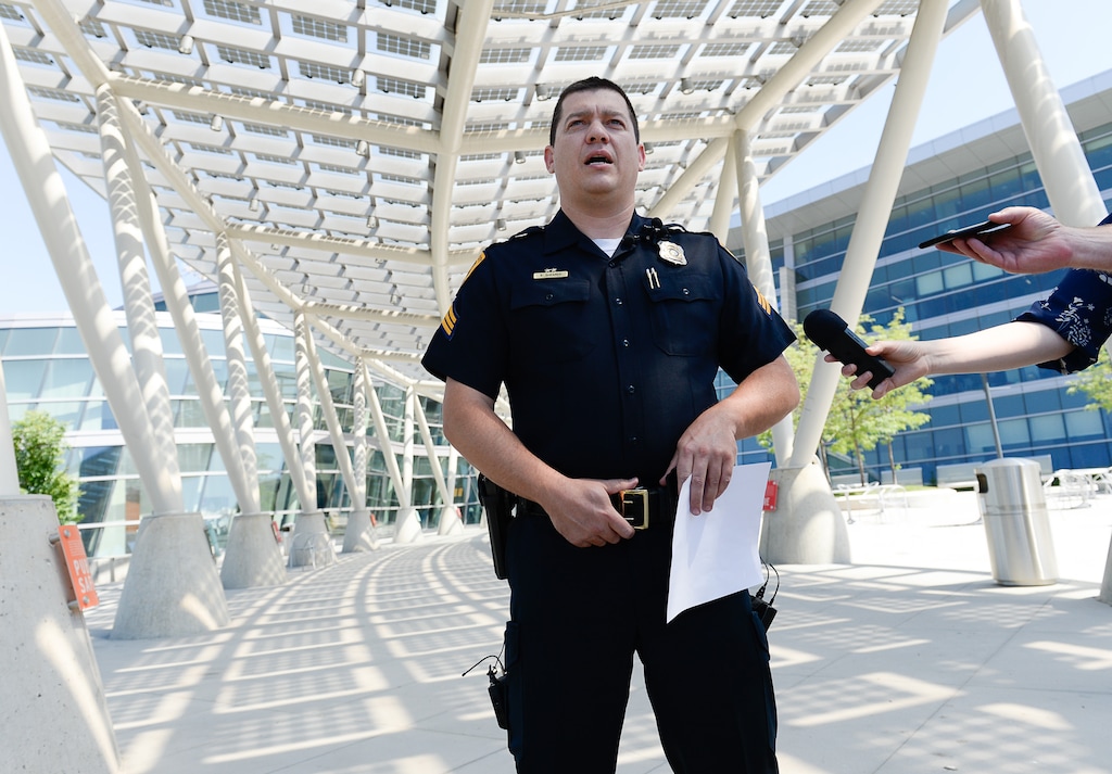 (Francisco Kjolseth | The Salt Lake Tribune) Salt Lake City Police Sgt. Brandon Shearer speaks with the media regarding a security guard who was booked for murder after shooting a man who was trespassing outside the Department of Workforce Services in Salt Lake City earlier in the day on Wed. June 20, 2018.