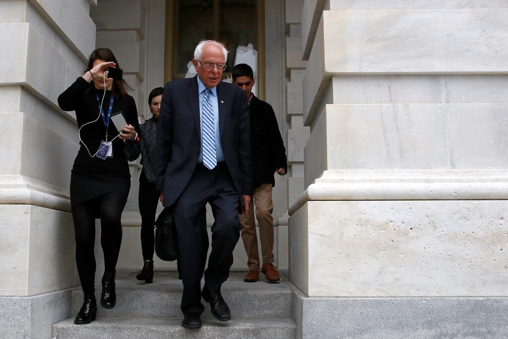 (Patrick Semansky | AP) Democratic presidential candidate Sen. Bernie Sanders, I-Vt., departs Capitol Hill in Washington, Wednesday, March 18, 2020, after the Senate passed a second coronavirus response bill.