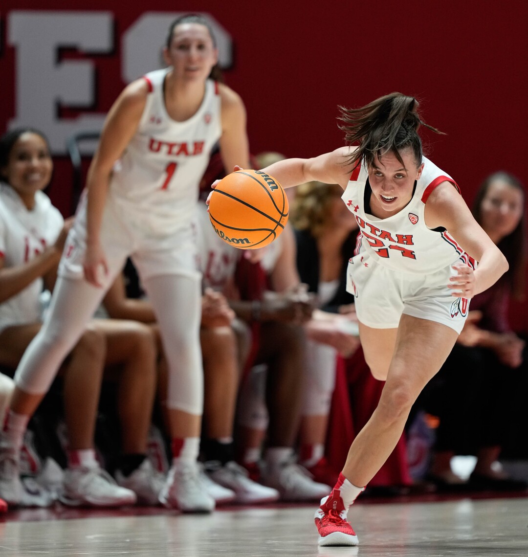 (Francisco Kjolseth | The Salt Lake Tribune) Utah Utes guard Kennady McQueen (24) regains her balance as the University of Utah hosts the Oklahoma Sooners in women’s NCAA basketball in Salt Lake City on Wednesday, Nov. 16, 2022.