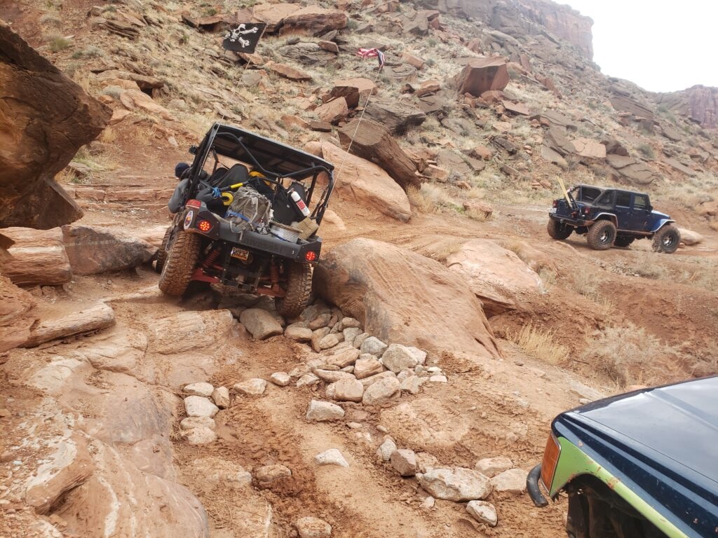 (Ride with Respect) Dave Hellman, the owner of Xtreme 4×4 tours, traverses a rocky turn on the Kane Creek Canyon Trail.