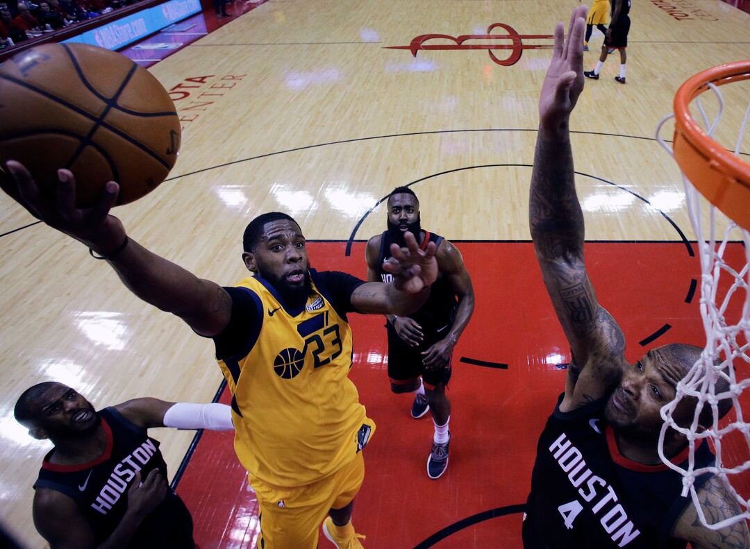 Utah Jazz forward Royce O'Neale (23) drives to the basket as Houston Rockets forward PJ Tucker (4) defends during the first half in Game 1 of an NBA basketball second-round playoff series, Sunday, April 29, 2018, in Houston. (AP Photo/Eric Christian Smith)
